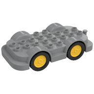 Duplo Car Base 4 × 8 with Four Black Wheels and Yellow Hubs