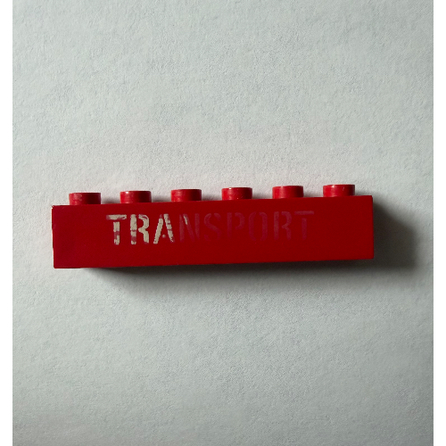 Brick 1 × 6 with 'TRANSPORT' Stencil White print Red