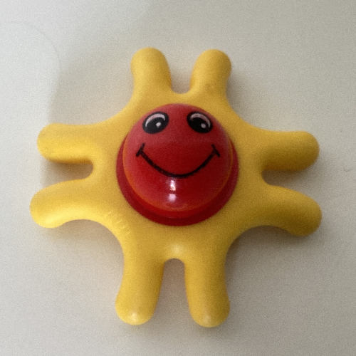 Primo Teether, 8 Arms, with Red Center and Smiling Face Print Yellow