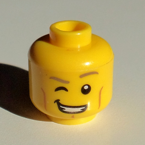 Minifig Head, Dark Tan Eyebrows, Wink, Teeth Smile print Yellow
