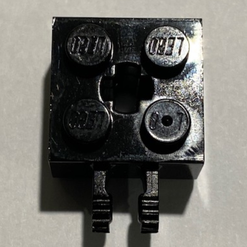 Hinge Brick 2 × 2 Locking with 2 Fingers Vertical and '+' Axle Hole, 9 Teeth Schwarz