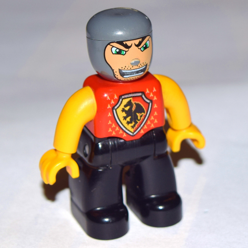 Duplo Figure with Rounded Head with Black Legs, Red Chest with Dragon Shield, Bright Light Orange Arms and Hands, Stubble and Open Mouth Red