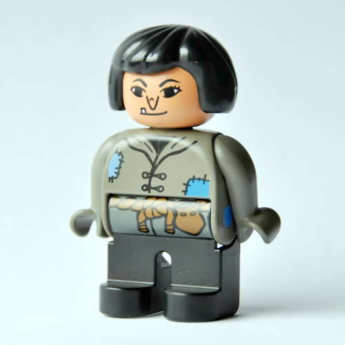 Duplo Figure, Early, Hair Bob Black, Black Legs, Tunic with Blue Patches and Rope Belt, Wart on Nose (Actress) Dunkelgrau