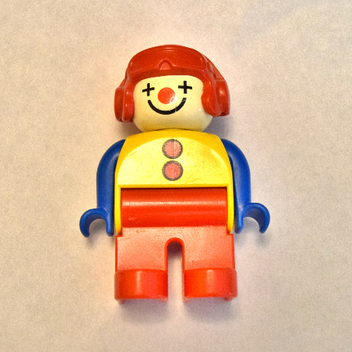 Duplo Figure, Early, Aviator Hat Red, Red Legs, with 2 Buttons, Blue Arms, Clown Face Paint Gelb