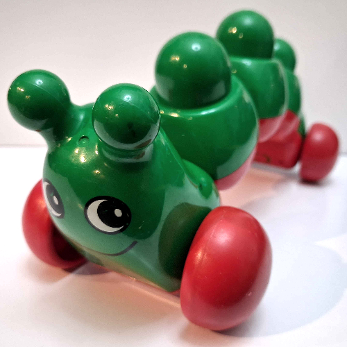 Primo Caterpillar with Red Wheels, Face print Grün