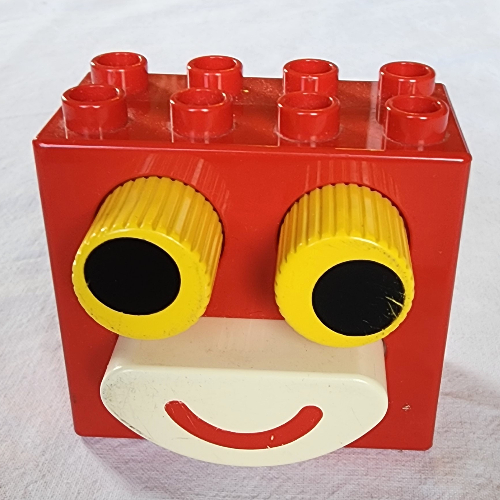 Duplo Stein 2 × 4 × 2 mit schwarzen Augen in Gelb und weißem Mund